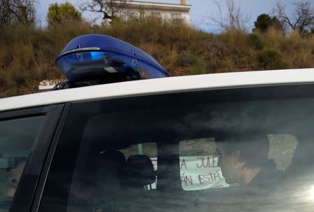 FILE PHOTO: A member of the miner rescue team sits in a police car as he is led by Spanish Civil Guards to the area where Julen, a Spanish two-year-old boy, fell into a deep well nine days ago when the family was taking a stroll through a private estate, in Totalan, southern Spain January 22, 2019. REUTERS/Jon Nazca