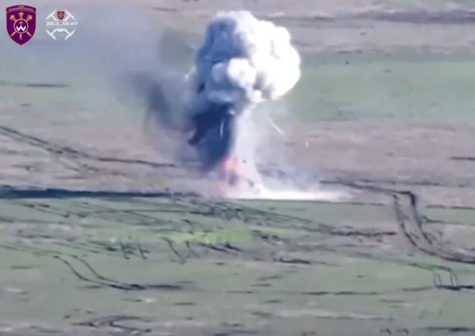 A Ukrainian drone strikes a Russian infantry fighting vehicle in April.