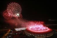 An aerial view shows fireworks over the Beira-Rio stadium during its opening ceremony in Porto Alegre April 5, 2014. The stadium will be one of the stadiums hosting the 2014 World Cup soccer matches. REUTERS/Diego Vara (BRAZIL - Tags: SPORT SOCCER WORLD CUP)