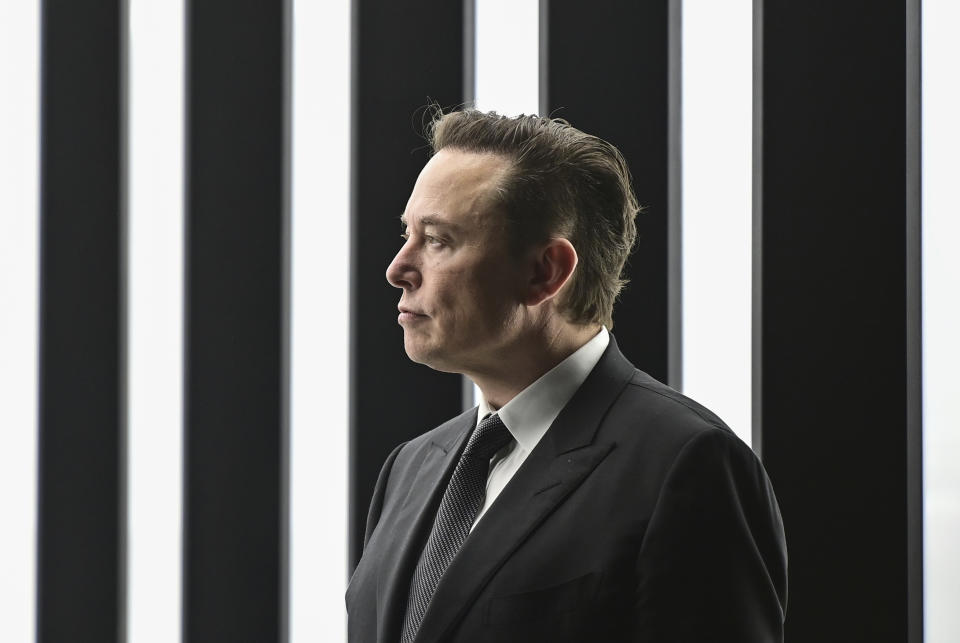 FILE - Elon Musk, Tesla CEO, attends the opening of the Tesla factory Berlin Brandenburg in Gruenheide, Germany, March 22, 2022. Musk, the world's richest man and the owner of SpaceX and Tesla, says he is a free speech absolutist who doesn't support the kind of content moderation that saw people like ex-President Donald Trump get banned for inciting violence (Patrick Pleul/Pool via AP, File)