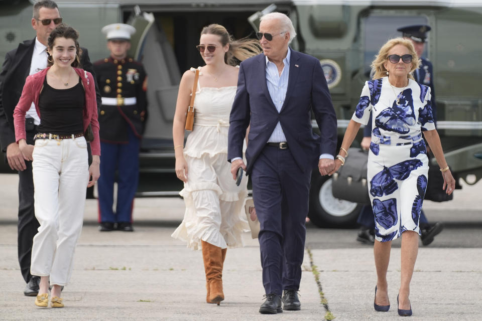 President Joe Biden, center right, and first lady Jill Biden, right, arrive on Marine One with granddaughters Natalie Biden, from left, and Finnegan Biden, at East Hampton Airport, Saturday, June 29, 2024, in East Hampton, N.Y. (AP Photo/Evan Vucci)