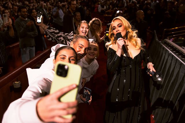 <p>Raven B. Varona</p> Adele interacting with fans in her custom La Ligne gown.