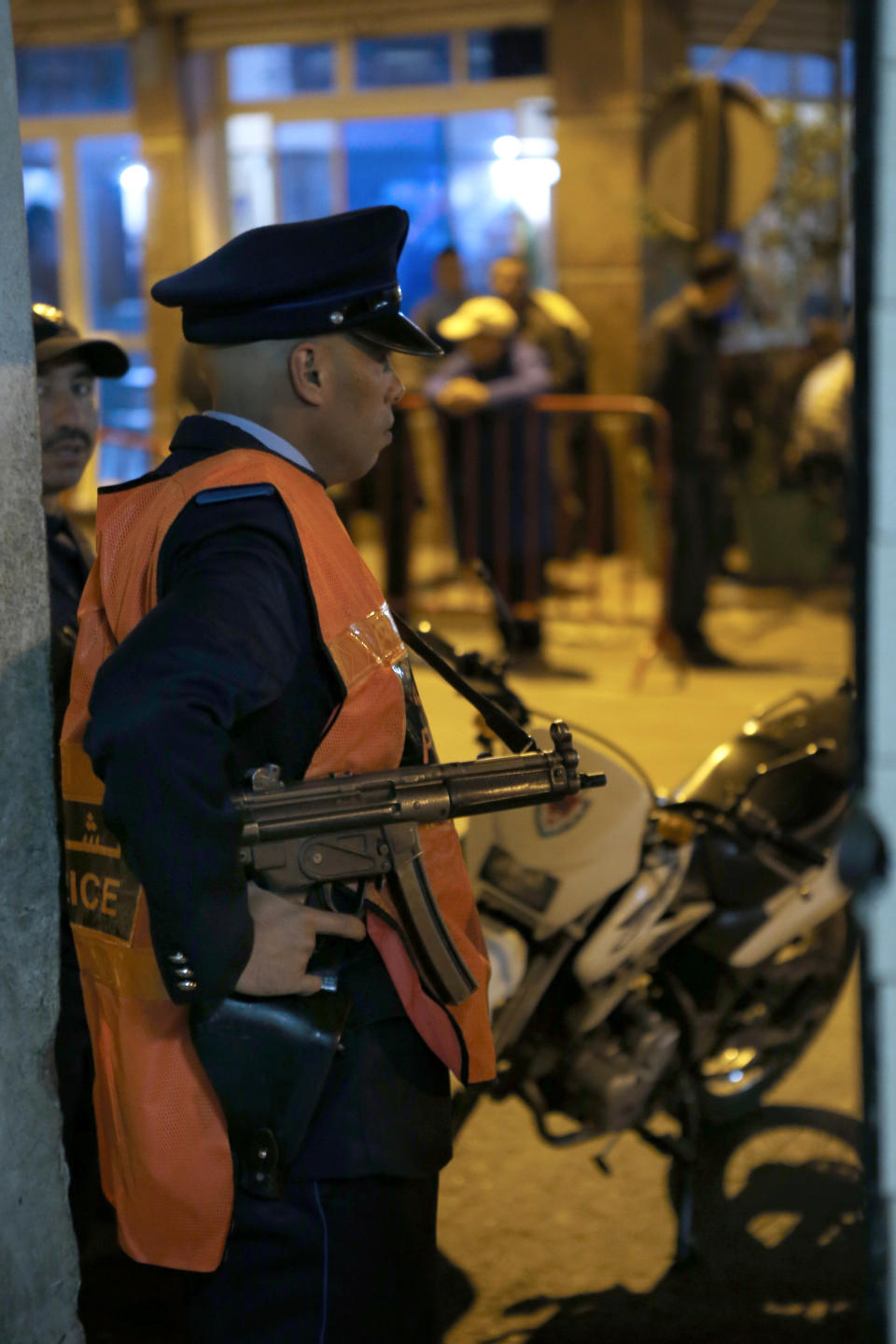 This Saturday April 26, 2014 photo shows a Moroccan police officer guarding the entrance of a police station in Casablanca, Morocco. As home to most of Morocco’s economy, as well as most its slums, Casablanca in particular has always had a crime problem. It is a city of extremes, with skyscrapers and highend nightlife on one hand and the other the crushing poverty that spawned the angry youth who killed 33 people in a spate of bombings in 2003.(AP Photo / Abdeljalil Bounhar)