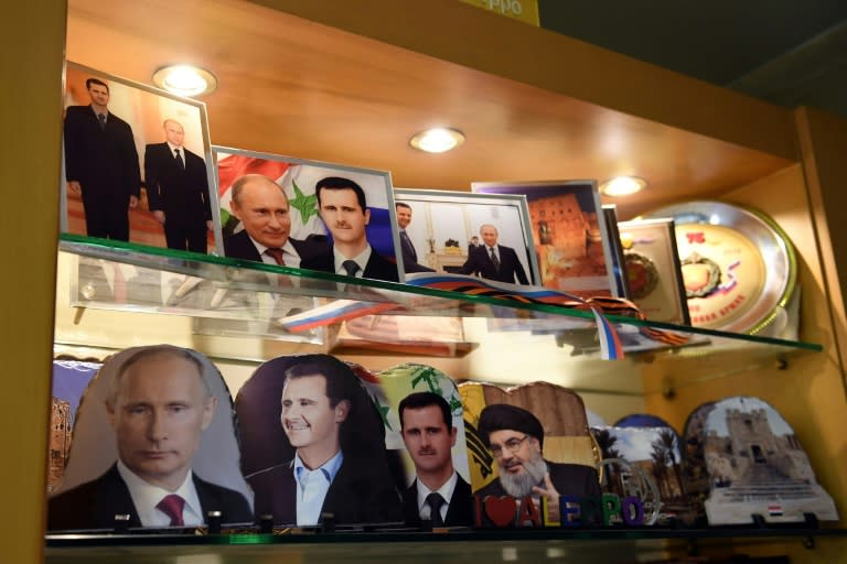 Portraits of Putin and Assad and Lebanese Hezbollah leader Hassan Nasrallah at a jewellery shop in Aleppo