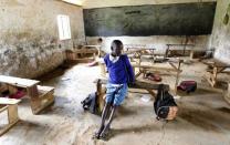 Seven-year-old Barack Obama Okoth, named after U.S. President Barack Obama, sits inside an empty classroom as he speaks with Reuters at the Senator Obama primary school in Nyangoma village in Kogelo, west of Kenya's capital Nairobi, June 23, 2015. REUTERS/Thomas Mukoya