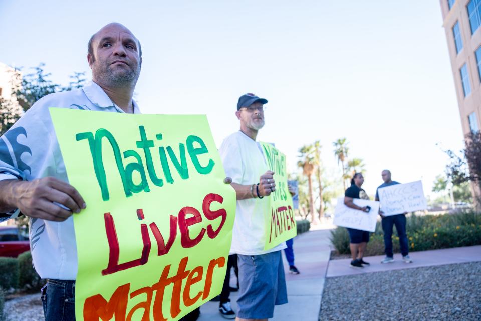 Robert Wood (left) and Jeffrey Steele (right) attend a rally outside the Arizona Department of Health Services in Phoenix on Sept. 26, 2023.