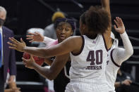 South Carolina forward Aliyah Boston (4) looks to pass against Texas A&M center Ciera Johnson (40) during the first half of an NCAA college basketball game Sunday, Feb. 28, 2021, in College Station, Texas. (AP Photo/Sam Craft)