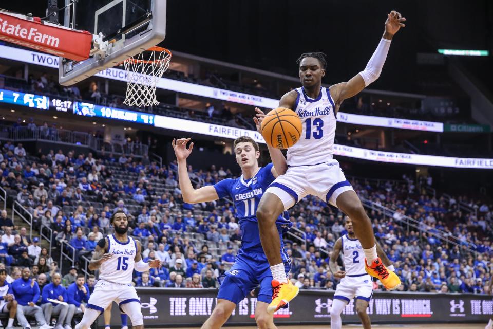 Creighton Bluejays center Ryan Kalkbrenner (11) and Seton Hall Pirates forward KC Ndefo (13) fight for a loose ball in the first half at Prudential Center.