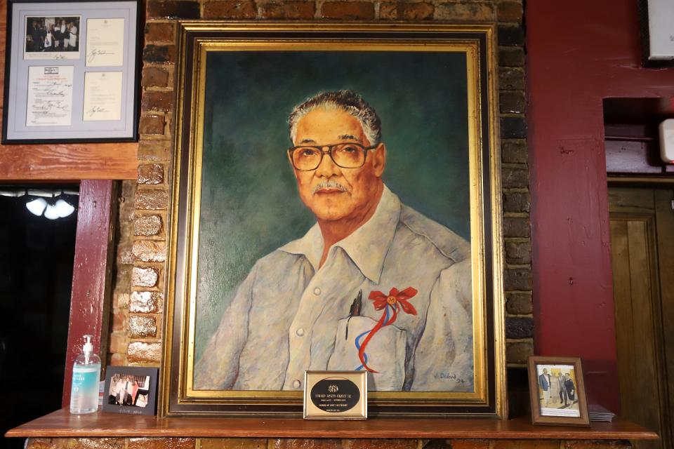 A painting of Eddie Baquet at Li'l Dizzy’s Cafe in the Treme neighborhood of New Orleans. Photographed on Sunday, March 7, 2021.