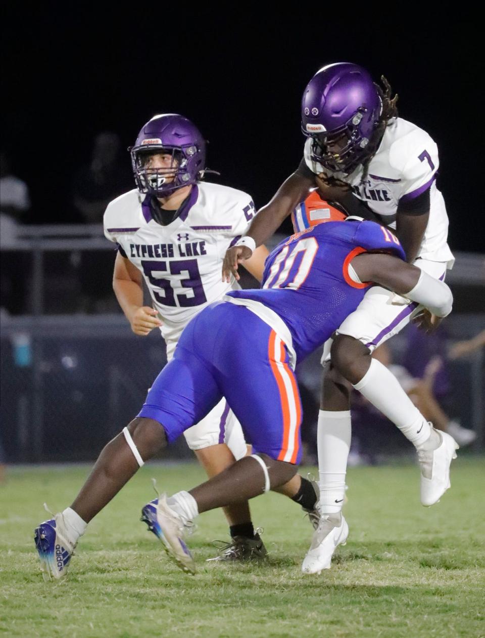 Cape Coral linebacker Derrick Oge tackles Cypress Lake quarterback Tyrese Nelson. Cape Coral High School hosted Cypress Lake for a Friday night football showdown September 15, 2023. Ricardo Rolon/USA TODAY NETWORK-FLORIDA