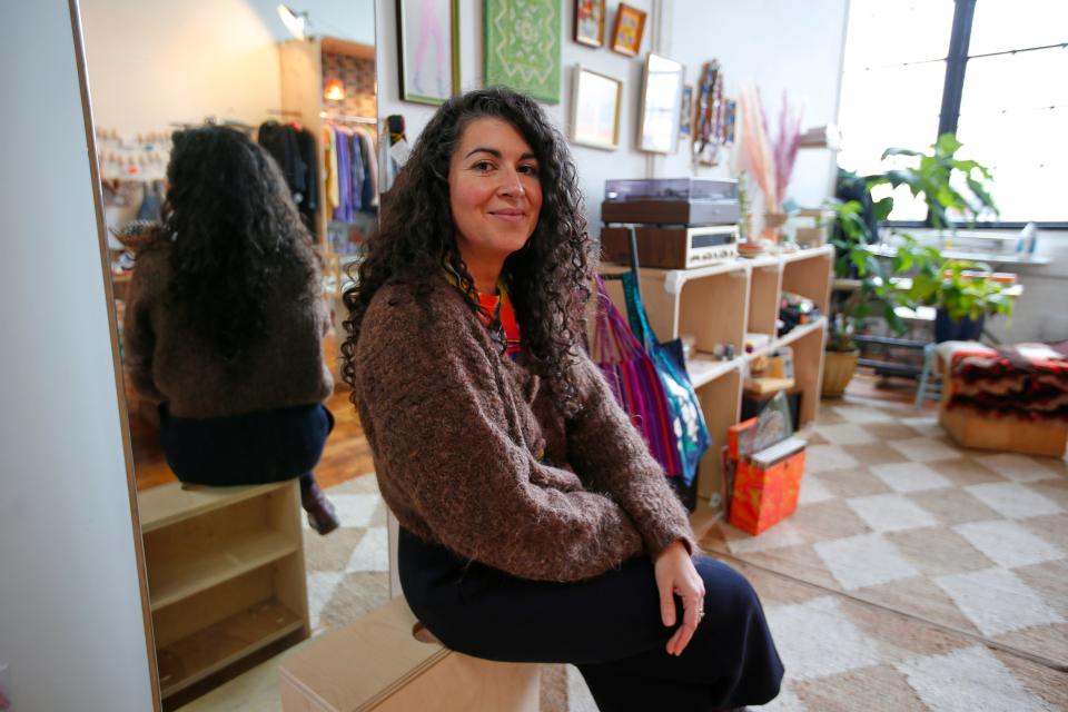 Claudia DeSouza-Baptista, owner of the newly opened Bushwood Tailors Opportunity Shop at the Kilburn Mill in New Bedford.