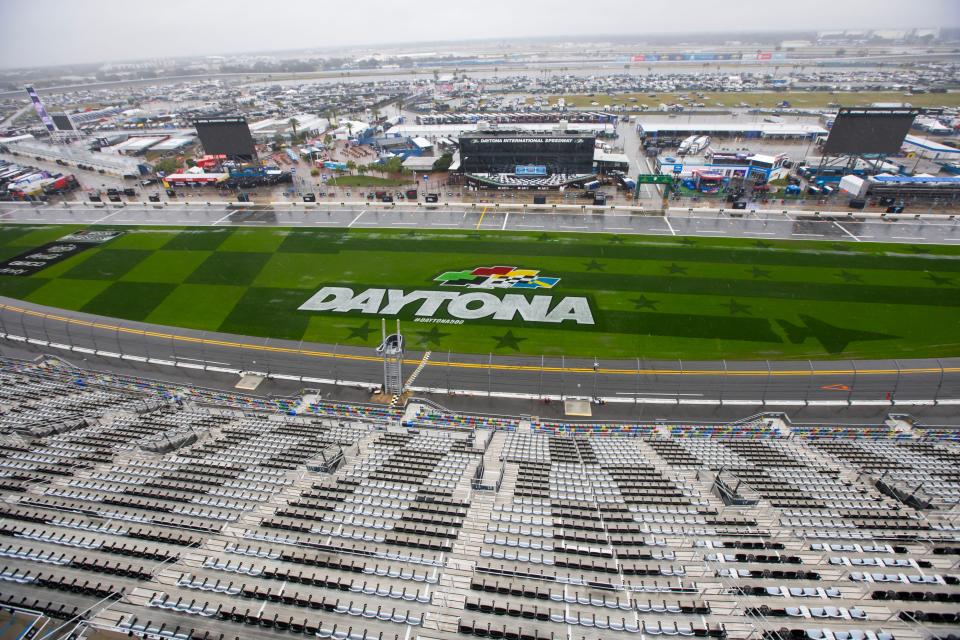 Overall view of empty grandstands at the start finish line in the tri-oval as it rains Sunday, February 18, 2024, following the postponement of the Daytona 500 to Monday due to rain at Daytona International Speedway in Daytona Beach, Florida.