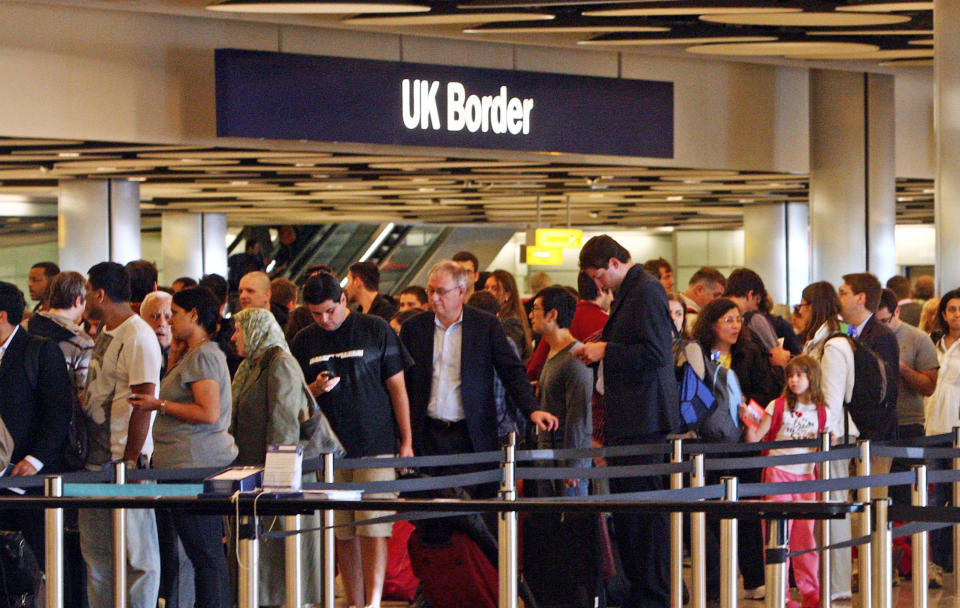 Queues at Border Control in Terminal Five of London's Heathrow Airport where some immigration and customs staff have joined a day of strikes by teachers, civil servants and other workers over Government plans to change their pensions, cut jobs and freeze pay.