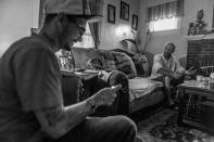 <p>Gene Robinson, right, a recovering heroin addict, with his fiancée’s son, Larry Fugate, left – also a recovering addict. (Photograph by Mary F. Calvert for Yahoo News) </p>