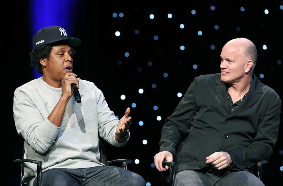 Rapper and business mogul Shawn "Jay-Z" Carter, left, speaks as Michael Novogratz, founder and CEO Galaxy Digital, listens during the launch of a partnership among entertainment moguls, recording artists, business and sports leaders who hope to transform the American criminal justice system, Wednesday, Jan. 23, 2019, in New York. The group, called the Reform Alliance, will be led by Van Jones, a CNN host, activist and former adviser to President Barack Obama. (AP Photo/Kathy Willens)