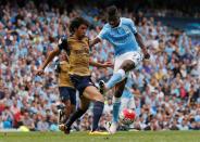 Britain Soccer Football - Manchester City v Arsenal - Barclays Premier League - Etihad Stadium - 8/5/16 Manchester City's Kelechi Iheanacho in action with Arsenal's Mohamed Elneny Action Images via Reuters / Jason Cairnduff Livepic EDITORIAL USE ONLY.