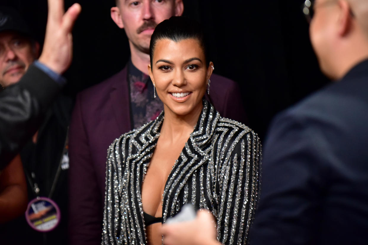 Kourtney Kardashian traded in her usual style for a catsuit at NYFW. (Photo: Rodin Eckenroth/WireImage)