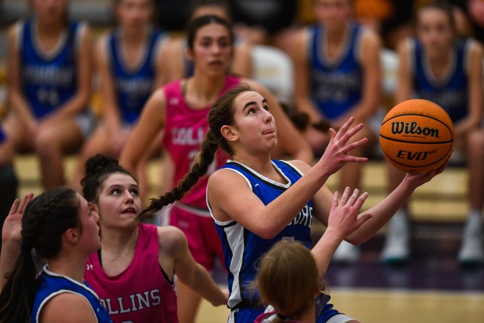 Poudre's Kavi Voglund (5) rises for a layup during a girls high school basketball game against Fort Collins on Thursday, Feb. 9, 2023 in Fort Collins, Colo. The Impalas won 38-28.