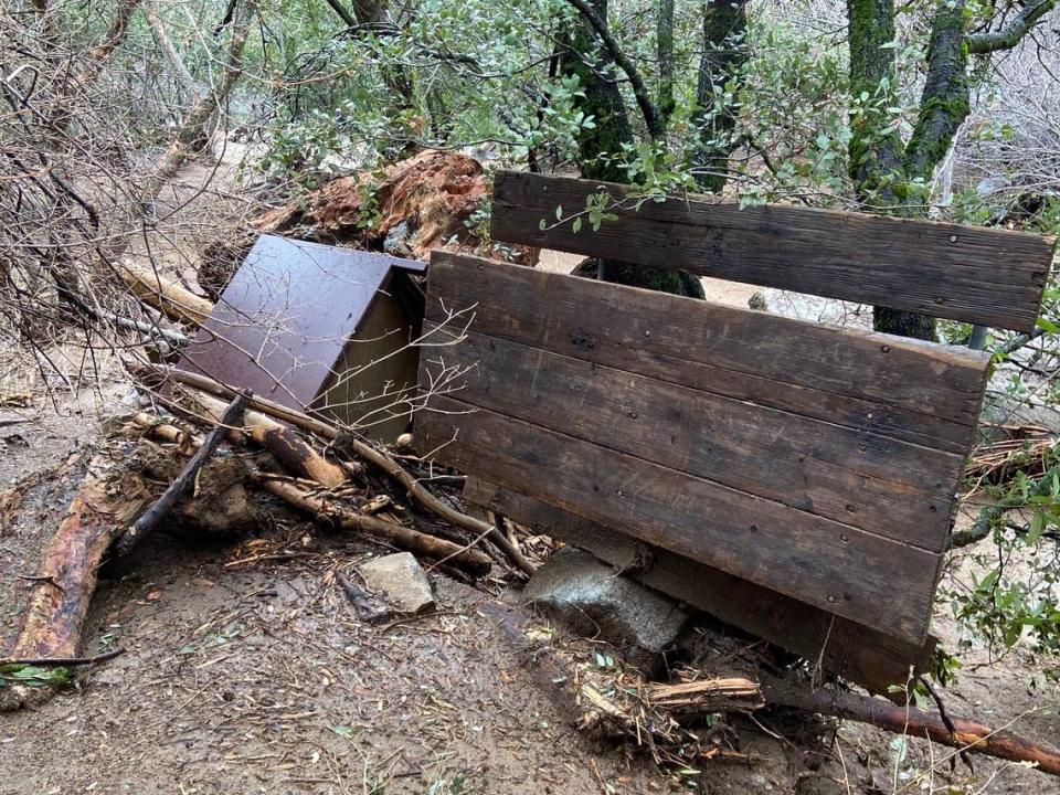 A picnic bench and bear box lay upended following a flood that overwhelmed the South Fork Campground in California’s Sequoia National Park. Photographed on Jan. 15, 2023.