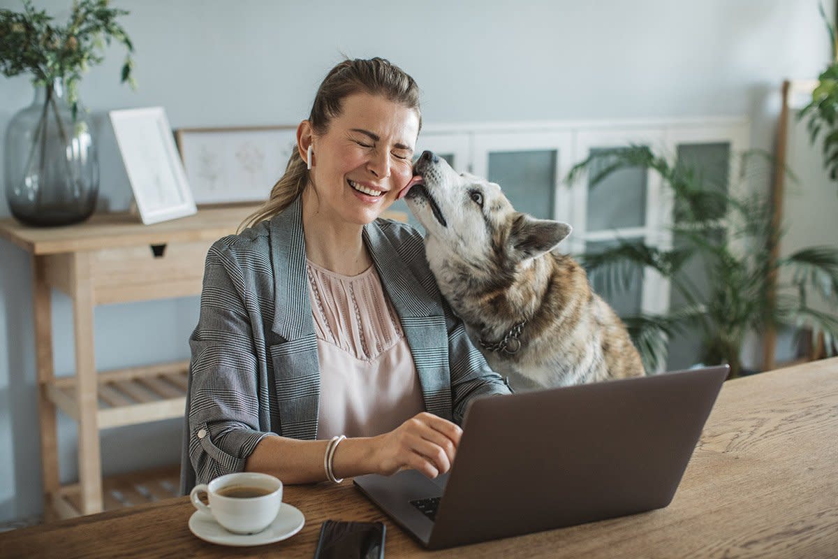 woman working from home with dog