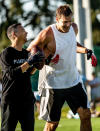 <p>A smiling Rob Gronkowski works out with TB12 co-founder and Tom Brady's body coach Alex Guerrero in Tampa, Florida.</p>