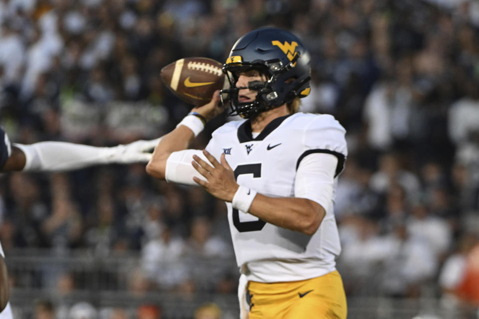 West Virginia quarterback Garrett Greene looks to pass during the first half of the team's NCAA college football game against Penn State, Saturday, Sept. 2, 2023, in State College, Pa. (AP Photo/Barry Reeger)