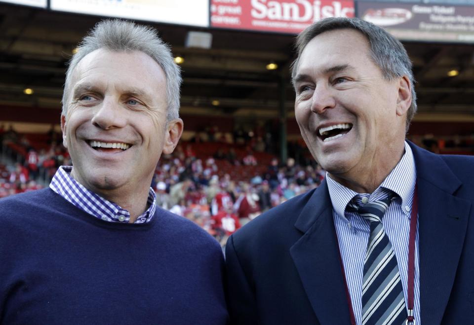 Dwight Clark (right) laughs with Joe Montana during a 49ers game in 2011 (AP)