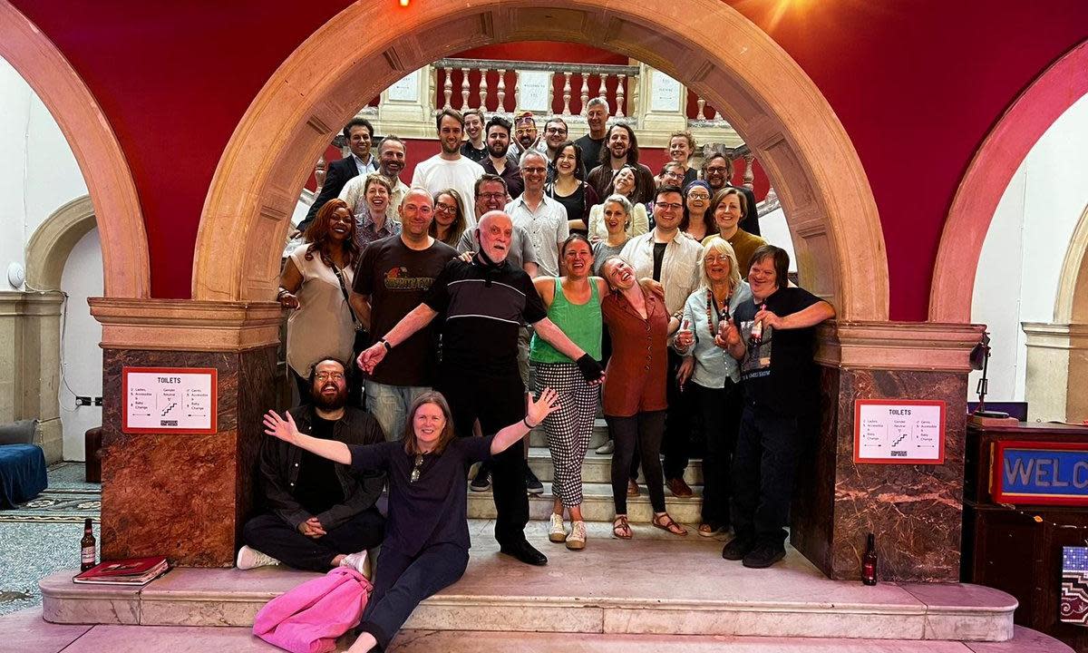 <span>‘They pick the right people’ … Pete Brookes, centre, the longest serving volunteer at Battersea Arts Centre, surrounded by BAC staff, volunteers and friends.</span><span>Photograph: Credit: Battersea Arts Centre</span>