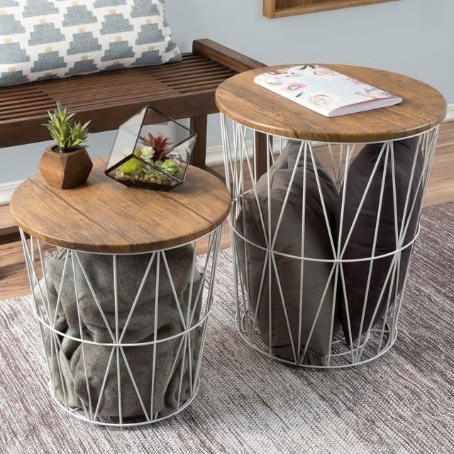 the two caged storage baskets with table top lids