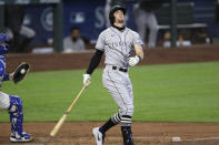 Colorado Rockies' Ryan McMahon spins around after striking out to end the top of the fourth inning of a baseball game against the Seattle Mariners, Sunday, Aug. 9, 2020, in Seattle. (AP Photo/Elaine Thompson)