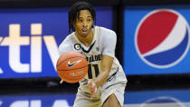 FILE - In this Jan. 16, 2021, file photo, Colorado guard Keeshawn Barthelemy passes the ball during the first half of an NCAA college basketball game against Stanford in Boulder, Colo. (AP Photo/David Zalubowski, File)