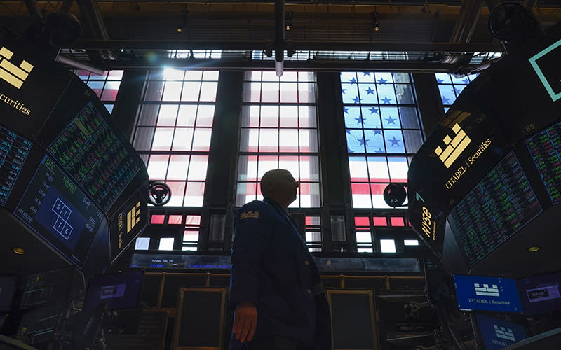 Traders work on the floor at the New York Stock Exchange