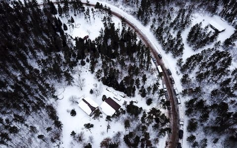 This aerial photo shows the cabin where 13-year-old Jayme Closs was held by Jake Thomas Patterson, is surrounded by law enforcement vehicles - Credit: Aaron Lavinsky/Star Tribune via AP