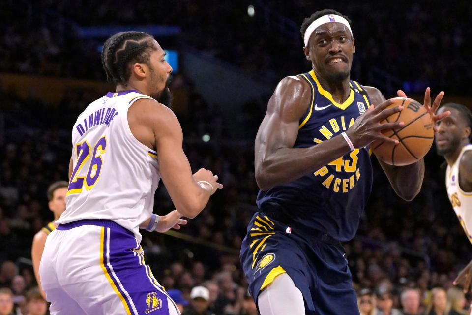 Mar 24, 2024; Los Angeles, California, USA; Indiana Pacers forward Pascal Siakam (43) is defended by Los Angeles Lakers guard Spencer Dinwiddie (26) in the first half at Crypto.com Arena. Mandatory Credit: Jayne Kamin-Oncea-USA TODAY Sports
