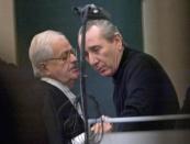 Vito Rizzuto (right) speaks with his attorney Jean Salois in Montreal on Feb. 6, 2004. Radio-Canada is reporting that Vito Rizzuto, the reputed head of the Montreal Mafia, has died. THE CANADIAN PRESS/Ryan Remiorz