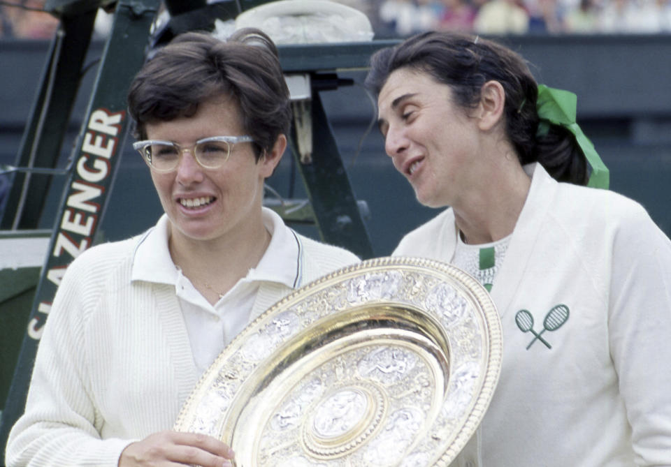 FILE - Billie Jean King, left, winner of the women's tennis final at Wimbledon in July 1968, holds the plate with Australia's Judy Tegart during the presentation after the match. Wednesday marks the 50th anniversary of the meeting on June 21, 1973, at the Gloucester Hotel — about a mile south of Hyde Park in the heart of the British capital — where King and nearly 60 other players agreed to form what today is known as the Women’s Tennis Association or WTA. (AP Photo/Robert Dear, File)