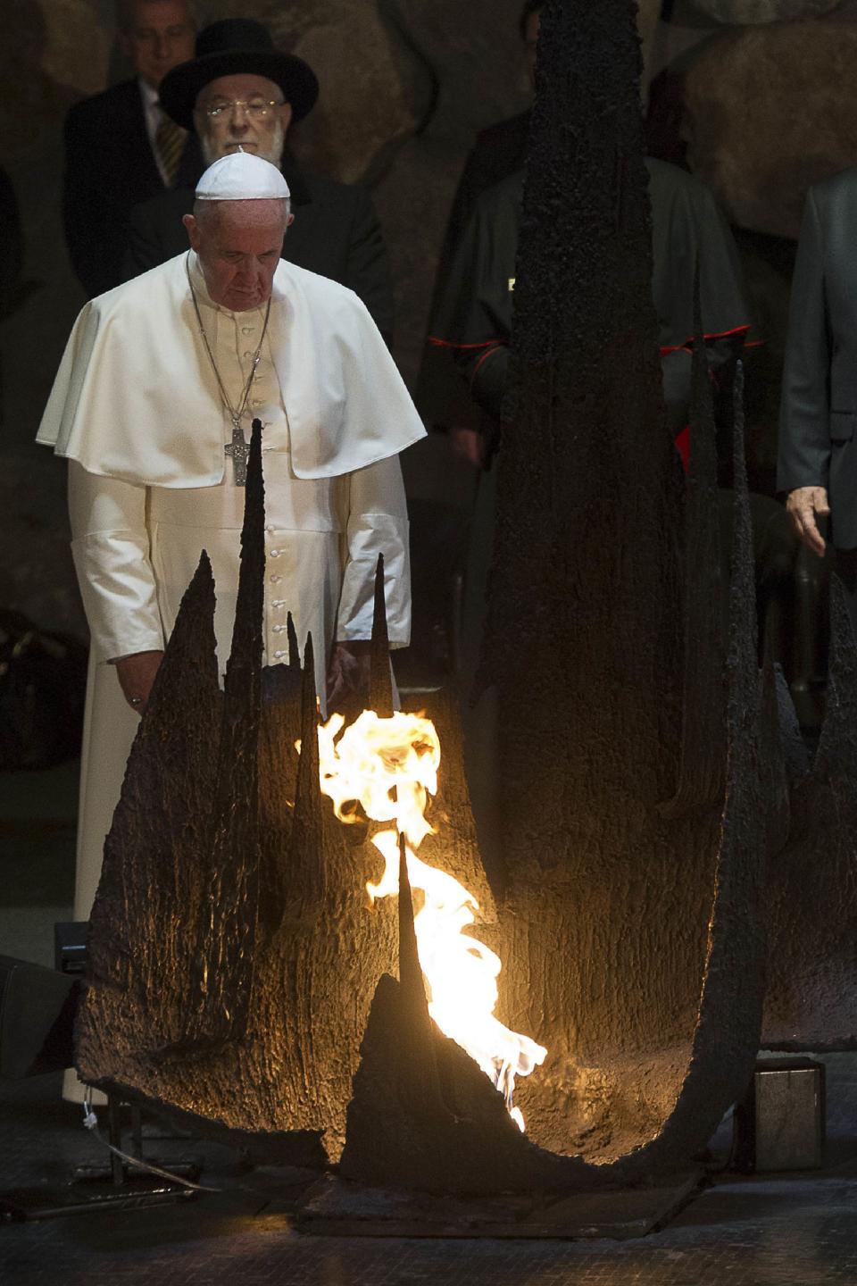 Pope Francis looks at the eternal flame, commemorating the six million Jews killed by the Nazis in the holocaust, during a ceremony in the Hall of Remembrance at the Yad Vashem Holocaust memorial in Jerusalem