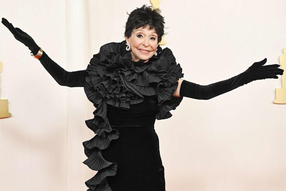 <p>Gilbert Flores/Variety via Getty</p> Rita Moreno makes a dramatic entrance in a Badgley Mischka and black pixie cut at 2024 Oscars