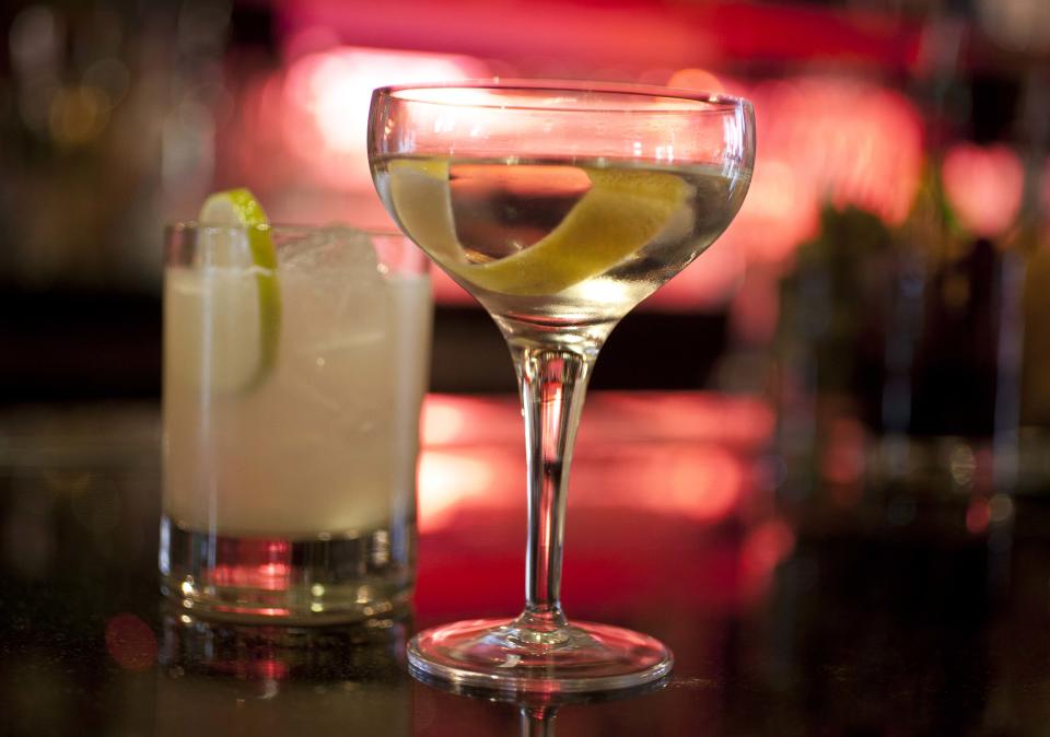 In this photo taken Thursday, Dec. 20, 2012, an Agave Margarita and gin Martini made by mixologist Jacques Bezuidenhout sit on a bar in the Starlight Room of the Sir Francis Drake Hotel in San Francisco. The first rule of drinking on a diet is, don't. Surely you saw the recent study that found that Americans were getting almost as many empty calories from alcohol as from soft drinks. The second rule of drinking on a diet is that since you probably will ignore Rule No. 1, find a way to enjoy alcohol without letting it swamp your healthy intentions. (AP Photo/Eric Risberg)