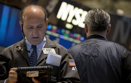 Traders work on the floor of the New York Stock Exchange September 15, 2014. REUTERS/Brendan McDermid