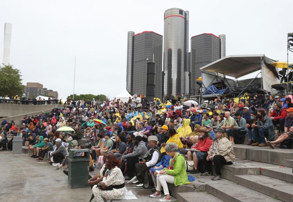 People listen to various artists perform during the Detroit Jazz Festival on a rainy day at Hart Plaza and Campus Martius, Sunday, September 4, 2022.