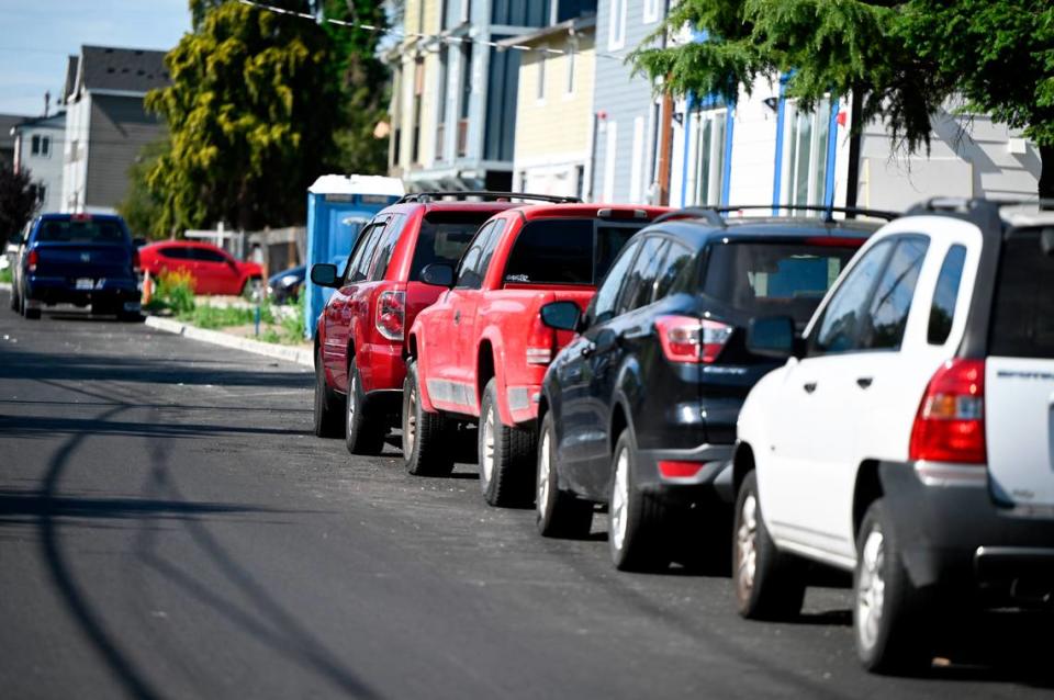 Cars park along South Puget Sound Avenue Wednesday, July 12, 2023, in Tacoma, Wash. The 4000 block has seen more than 120 apartment units approved since 2015 with just a total of 44 parking stalls listed in their MFTE applications.