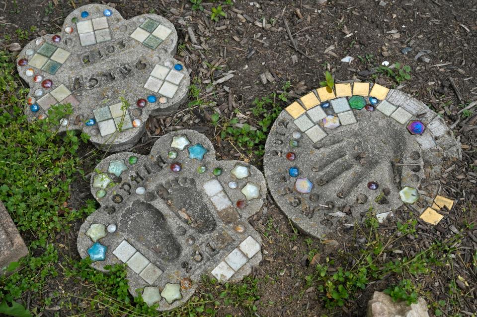 May 1, 2024; Columbus, Ohio, USA; 
Homemade mosaic stones are displayed outside Sheryl Brown’s rented townhome on Griggsview Court near Hilliard. Brown has lived in the complex for many years, creating memories with her family.