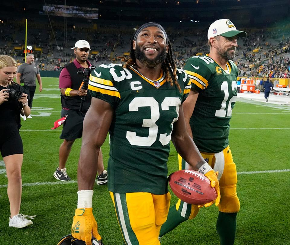 Green Bay Packers running back Aaron Jones (33) and Green Bay Packers quarterback Aaron Rodgers (12) walk of the after their game against the Green Bay Packers on Sunday, Sept. 18, 2022 at Lambeau Field in Green Bay.