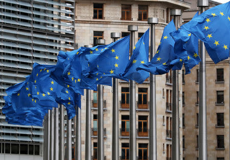 FILE PHOTO: European Union flags fly outside the European Commission headquarters in Brussels, Belgium, March 6, 2019. REUTERS/Yves Herman/File Photo