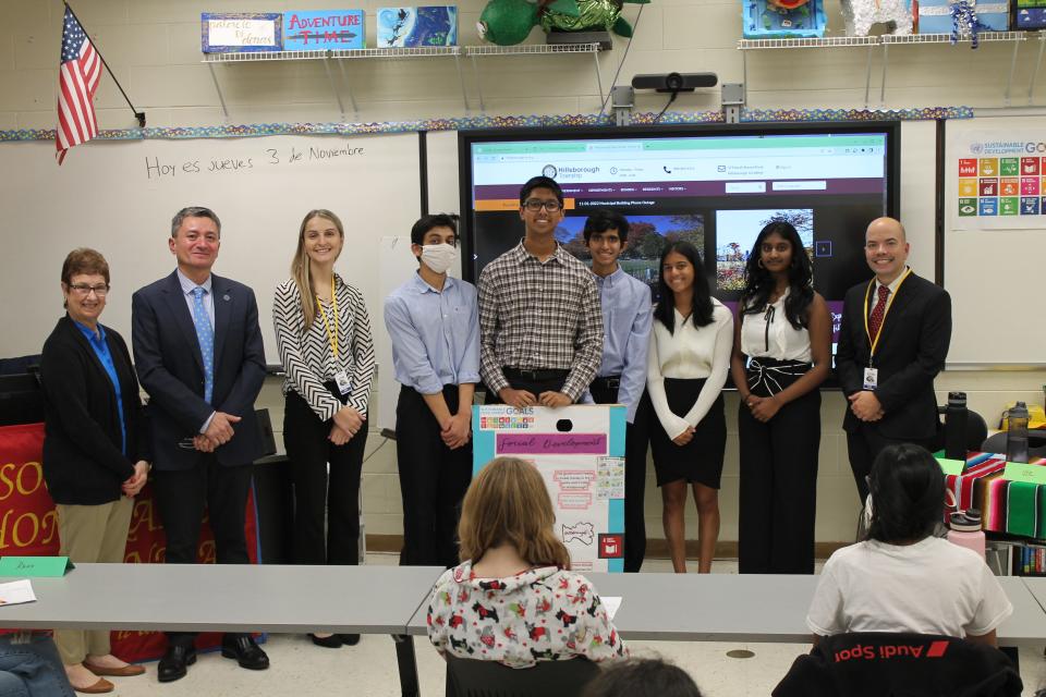 (Left to right) SCVTHS Supervisor of Academics Teresa Morelli; SCVTHS Spanish Instructor Guillermo Reina; Hillsborough Township Economic & Business Development Director Zuzana Karas; SCVTHS students George Thomas of Bridgewater, Arnav Khanna of Hillsborough, Vir Trivedi of Hillsborough, Katelyn Almeida of Green Brook, Sheena Ravoory of Hillsborough, and Hillsborough Township Business Advocate and Sustainability Director David Kois pose for a photo after the Hillsborough presentation.