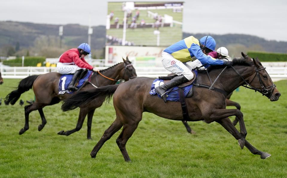 Harry Skelton riding Langer Dan (blue/yellow) clear the last to win The Coral Cup Handicap Hurdle during day two of the Cheltenham Festival 2024 at Cheltenham Racecourse on March 13, 2024 in Cheltenham, England