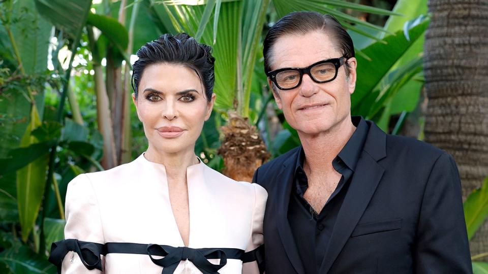 Lisa Rinna and Harry Hamlin posing together outside