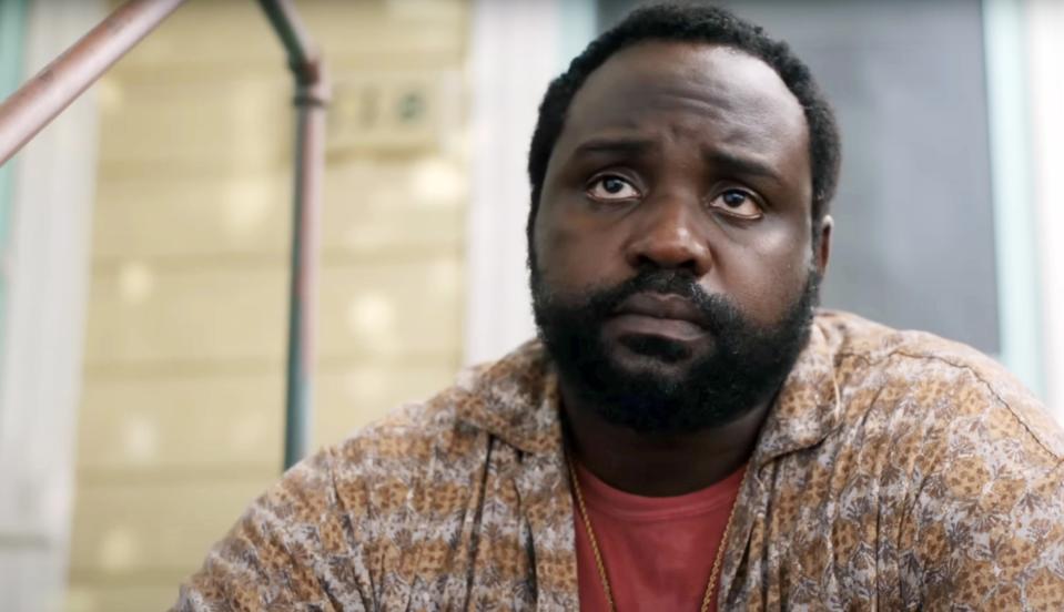 Brian Tyree Henry sits on a proch