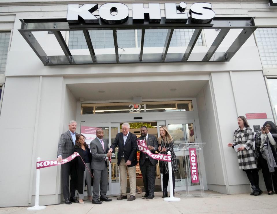 Milwaukee Mayor Cavalier Johnson (third from left) and Kohl's CEO Tom Kingsbury (third from right) celebrate after the ribbon is cut at the opening of the new Kohl's store at 630 N. Vel R. Phillips Ave. in downtown Milwaukee on Friday, Nov. 3, 2023.
